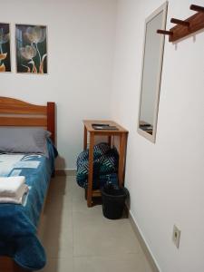 Cama ou camas em um quarto em Chalés e suítes lima