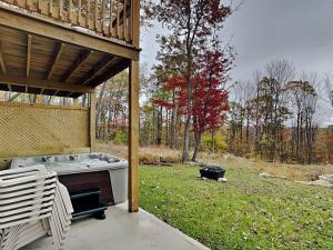a screened in porch with a stove in a yard at Majestic Manor in McHenry