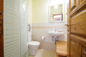 a bathroom with a toilet and a sink at Holiday house Elliniko Arcadia in Elliniko +3 photos