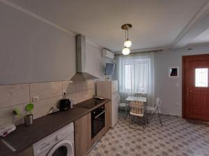 a kitchen with a sink and a dishwasher at Athinas Residence in Myrina