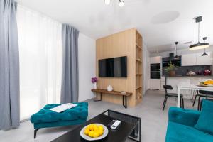 a living room with a couch and a table at Apartment Bracholet in Supetar
