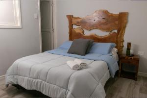 Postel nebo postele na pokoji v ubytování Casa Hotel Alicia Filandia