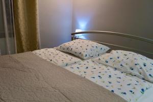 Postel nebo postele na pokoji v ubytování GM Home