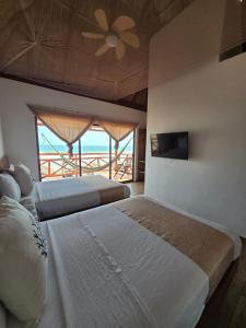 Ένα ή περισσότερα κρεβάτια σε δωμάτιο στο Aquetzalli Club de Playa