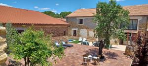 an aerial view of a house with a patio and trees at Damajuana in Villoslada