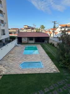 Bazén v ubytování Conforto e Praia nebo v jeho okolí + 10 fotografií