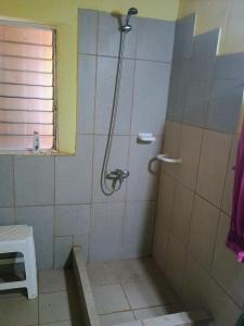 a shower stall in a bathroom with a window at Ñanderoga in San Marcos Sierras