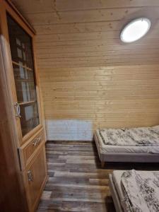 Łóżko lub łóżka w pokoju w obiekcie Wypoczynek Hnatczak