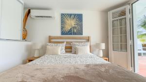 Letto o letti in una camera di Lagon privé du Diamant