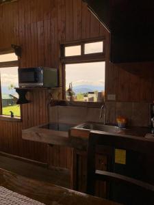 TV a/nebo společenská místnost v ubytování Cabaña Rancho Don Marino