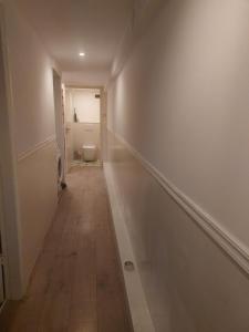 an empty hallway with a toilet in a bathroom at Cosy appartment in Arnhem