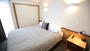 Postel nebo postele na pokoji v ubytování Dunedin Leisure Lodge - Distinction