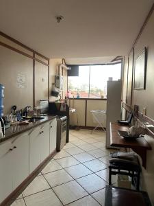 Kuchyň nebo kuchyňský kout v ubytování Conforto e Praia