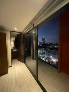 a room with a view of a city at night at Colonia Americana Vista Home in Guadalajara