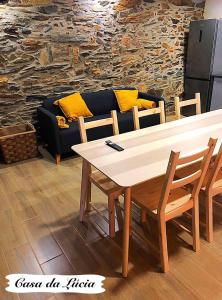 a living room with a table and a couch at Casa da Lúcia in Bragança +6 photos