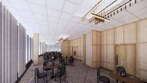 明尼阿波利斯Sheraton Minneapolis Downtown Convention Center的走廊上摆放着桌椅