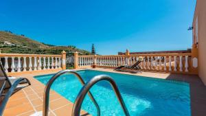 a swimming pool on the balcony of a house at Gonzalez Almuñécar by Ruralidays in Almuñécar