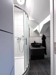 a bathroom with a shower and a sink at Kuriózum vendégház in Szeged +43 photos