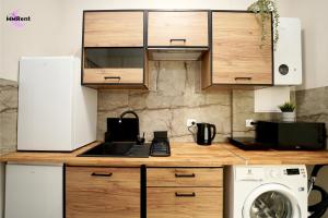 a kitchen with a sink and a washer at MMRent Manhattan Room in Gdańsk