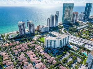 an aerial view of a city and the ocean at Luxury Ocean Reserve Condo Pool, Gym & Beach Access in Sunny Isles Beach
