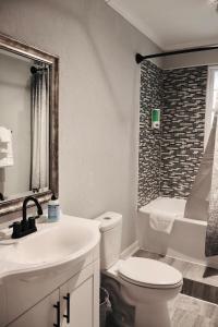 a bathroom with a toilet and a sink and a shower at Spacious 3 Bedroom , 1 Bath House Pet friendly in Red Top +16 photos