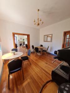 a room with tables and chairs and a dining room at Hotel boutique Paihuen in Valparaíso +25 photos