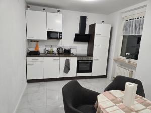 Kuchyň nebo kuchyňský kout v ubytování AlSa Apartments