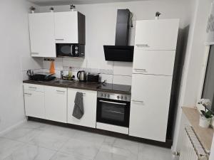 Kuchyň nebo kuchyňský kout v ubytování AlSa Apartments
