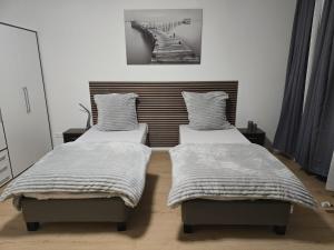 Postel nebo postele na pokoji v ubytování AlSa Apartments