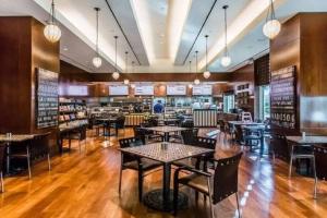 a dining room with tables and chairs in a restaurant at MGM 1BR Mountain View Balcony 28802 in Las Vegas