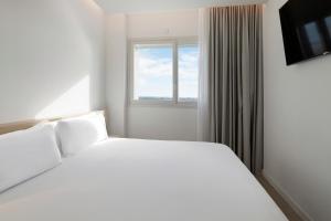 B&B HOTEL Madrid Carabanchel客房内的一张或多张床位