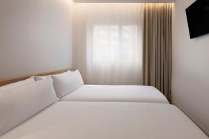 B&B HOTEL Madrid Carabanchel客房内的一张或多张床位