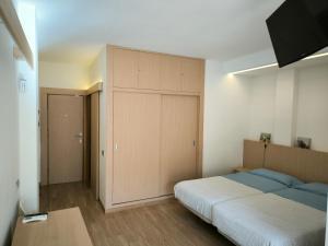 Ein Bett oder Betten in einem Zimmer der Unterkunft Relax and Beach
