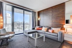 a living room with a couch and a table at Mountain-View Studio w BALCONY ACCESS Palms 36305 in Las Vegas
