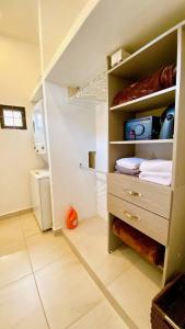 a room with a closet with a bed in it at Ajijic 1 Bedroom Guesthouse -Walk To Everything -Patio -Bikes - Pickleball Court in Ajijic