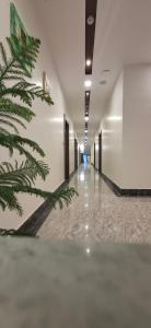 an empty hallway with a christmas tree in a building at BlueNeck Ayodhya-Near ShriRam Mandir in Ayodhya