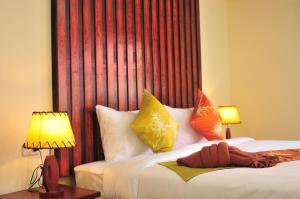 Una cama o camas en una habitación de Phi Phi Little Star Resort