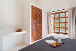Ένα ή περισσότερα κρεβάτια σε δωμάτιο στο Modern Tropical Villa in Bacalar +10 φωτογραφίες