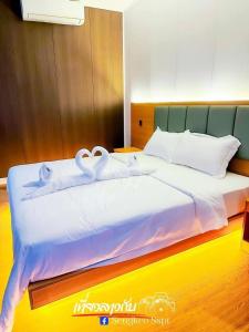 Postel nebo postele na pokoji v ubytování Romantic Resort MuangFuang