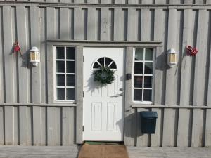 a white door with a wreath on it on a building at Holiday Home Villa Gol in Gol