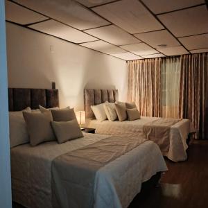Ένα ή περισσότερα κρεβάτια σε δωμάτιο στο Modern, Comfortable, Spacious & Central