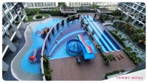 an overhead view of a swimming pool in a building at HS Cozzy Home in Kota Kinabalu