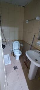 a bathroom with a toilet and a sink at Furnished daily studio basis in Dubai