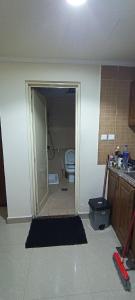 a room with a bathroom with a toilet in it at Furnished daily studio basis in Dubai +5 photos