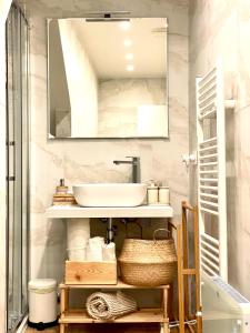 a bathroom with a sink and a mirror at Apuliantales Bari-Cozy Suite in Carbonara di Bari +72 photos