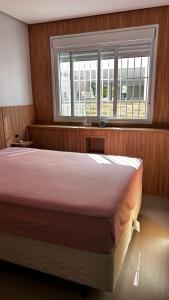 Postel nebo postele na pokoji v ubytování Residencial ilha d florence