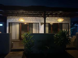 a house with two lights on top of it at Sayang Bungalows in Kuta Lombok