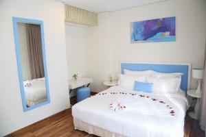 Ліжко або ліжка в номері Palmier Hotel - Art House Da Nang