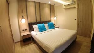 Postel nebo postele na pokoji v ubytování Wyatt Hotel Jomtien Beach