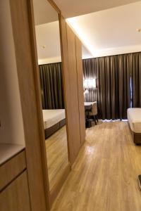 Postel nebo postele na pokoji v ubytování Wyatt Hotel Jomtien Beach